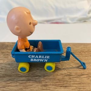 Vintage 1950 Peanuts Charlie Brown sitting in metal blue wagon w/yellow wheels